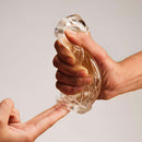 Person holding The Handy Dream Collection Lotus Sleeve, demonstrating its realistic design and texture.