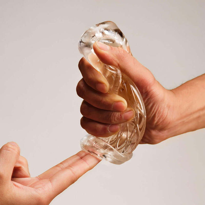 Person holding The Handy Dream Collection Lotus Sleeve, demonstrating its realistic design and texture.