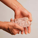 The Handy Dream Collection Chrysm Sleeve held in hands, showcasing its textured design and flexible material.