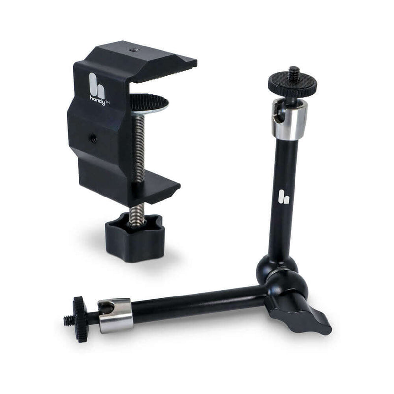 The Handy Handsfree Desk Mount showing its adjustable clamp and sturdy base for hands-free use.