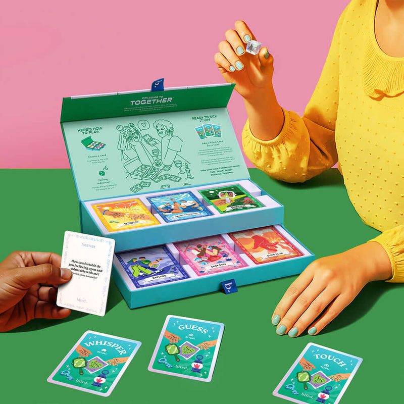 Biird x Jouissance Club Together Couples Card Game in a stylish box with colorful cards for intimate conversations.