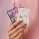 Biird x Jouissance Club Together Couples Card Game showing cards in a hand, featuring a love language question.