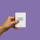 Hand holding a card from the Biird x Jouissance Club Together Couples Card Game with a thought-provoking question.