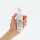 Tenga Iroha Item Cleaner for Silicone Toys in foam pump bottle held by hand.
