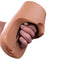 PDX Plus Pussy Pounder Squeeze Stroker Brown being squeezed by a hand, showcasing its lifelike material.