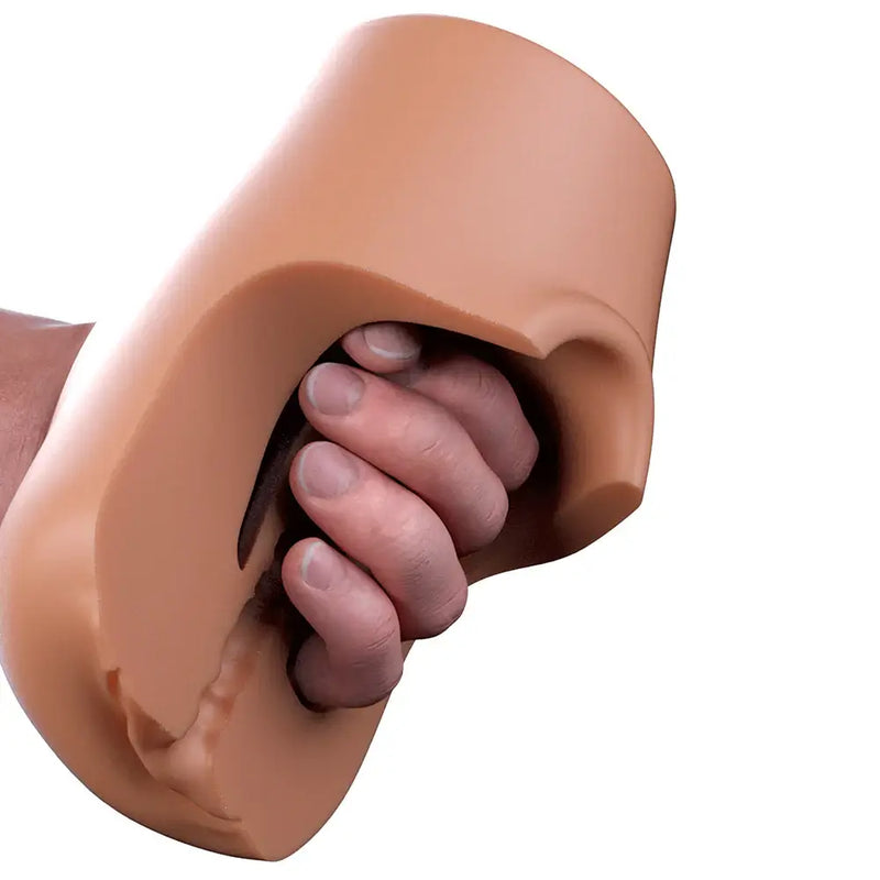 PDX Plus Pussy Pounder Squeeze Stroker Brown being squeezed by a hand, showcasing its lifelike material.
