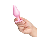 A hand holding the b-Vibe Butties B-Mine Butt Plug, a beginner-friendly silicone anal toy.