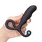 b-Vibe P-Spot Vibing Prostate Massager held in a hand, showcasing its sleek design and stimulation features.