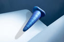 b-Vibe Anal Stretcher Training Cone in blue resting on a smooth surface.