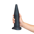 Hand holding the b-Vibe Fisting Anal Trainer displaying its smooth, cone-shaped design and structured training features.