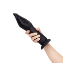 b-Vibe Vibrating Silicone Fisting Dildo being held in hand, showcasing its lifelike design and powerful vibrations.