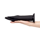 b-Vibe Vibrating Silicone Fisting Dildo in a hand, showcasing its lifelike design and premium silicone material.
