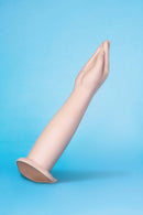 b-Vibe Silicone Hand Fisting Dildo with realistic arm shape and tapered fingers on a blue background.