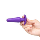 b-Vibe Butties Rookie Beginners Starter Silicone Plug held in hand, showcasing its slim design and tapered tip.