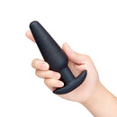 b-Vibe Butties Hefty 5.5 inch Weighted Anal Plug held in hand, showcasing its smooth, body-safe silicone design.