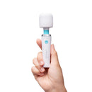 Le Wand Classique Mini Wand Massager held in hand, showcasing its compact and sleek design for relaxation.
