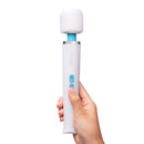 Le Wand Classique Petite Wand Massager held in hand, featuring a compact design and control buttons for easy use.