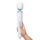 Le Wand Classique Plug-In Wand Massager held in hand for powerful muscle relief and relaxation.