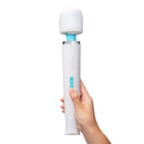 Le Wand Classique Rechargeable Wand Massager held in hand, showcasing ergonomic design and control button.