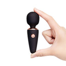 Le Wand Mini Micro Wand Black held in hand showcasing its compact design and stylish features.