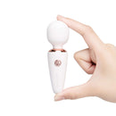 Le Wand Mini Micro Wand White held in hand, showcasing its compact, travel-friendly design.