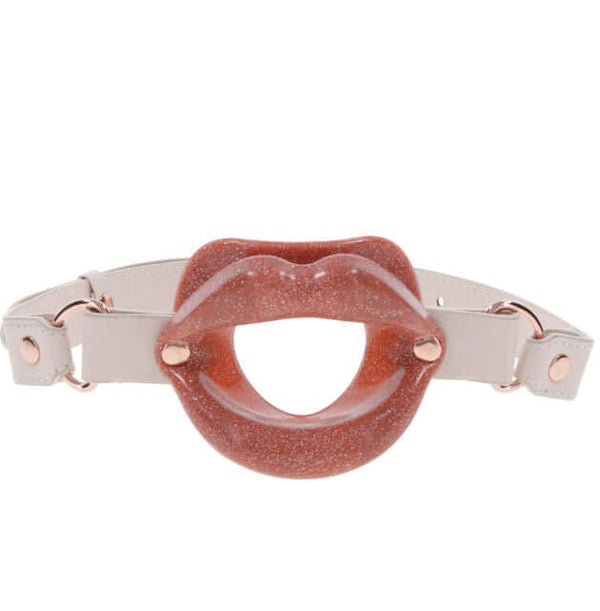 Peaches 'n CreaMe Silicone Lips Gag with Flirty Peach, Faux Leather Strap, and Adjustable Fit for playful and seductive oral play.