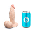 b-Vibe Slipskin Realistic Silicone Dildo 6 inch Girthy Cream next to a blue soda can for size comparison.
