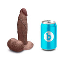 b-Vibe Slipskin Realistic Silicone Dildo 6 inch Girthy Brown next to a can for size reference.