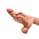 b-Vibe Slipskin Realistic Silicone Dildo 8 inch Girthy Mocha held in hand, showcasing its lifelike design and texture.