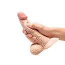 b-Vibe Slipskin Realistic Silicone Dildo 6.5 inch Curved Cream being held with a realistic texture and design.
