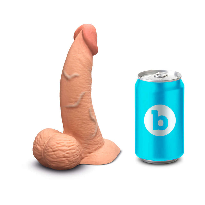 b-Vibe Slipskin Realistic Silicone Dildo 6.5 inch Curved Mocha next to a beverage can for size comparison.