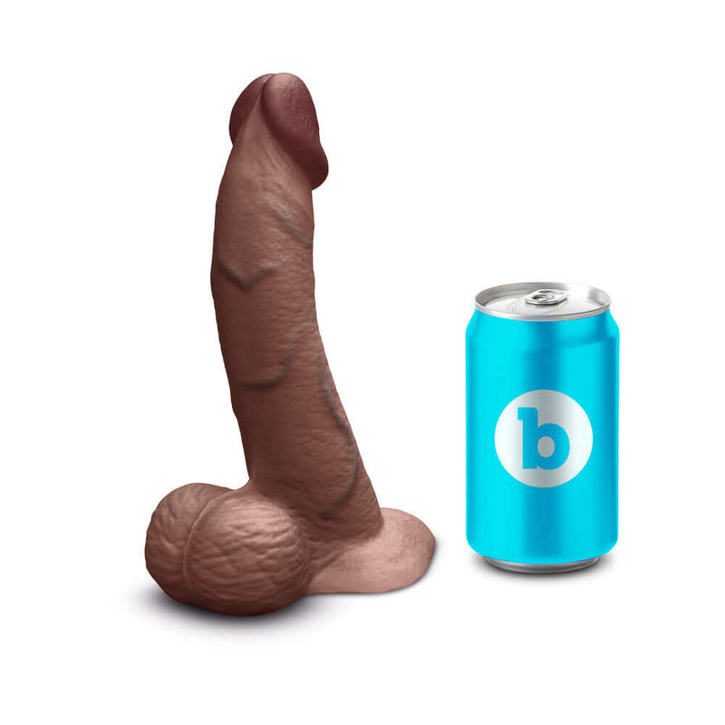 b-Vibe Slipskin Realistic Silicone Dildo 8 inch Curved Brown next to a can for size comparison