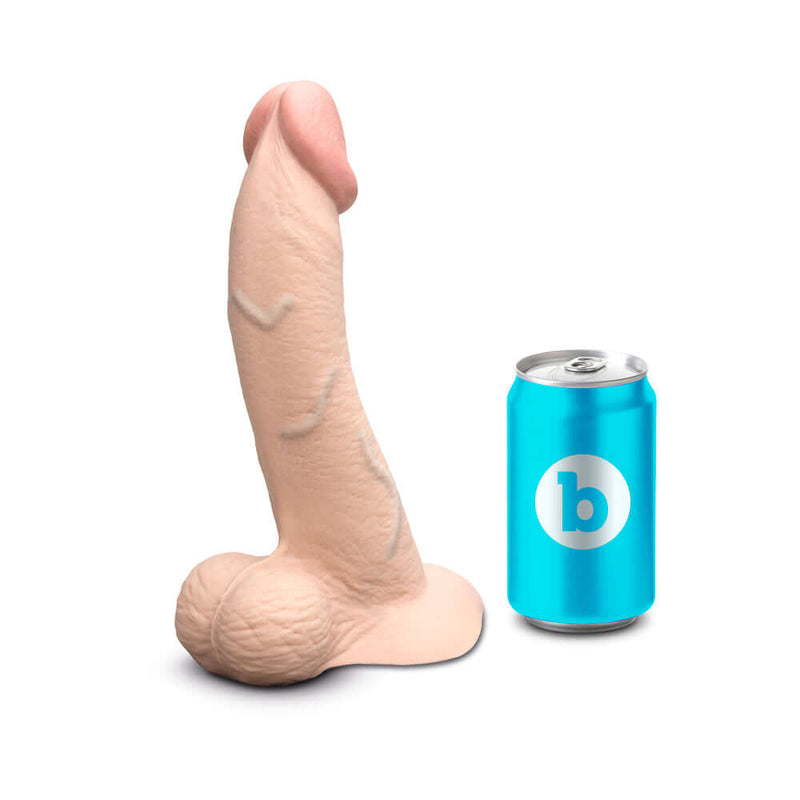 b-Vibe Slipskin Realistic Silicone Dildo 9 inch Curved Cream next to a soda can for scale.