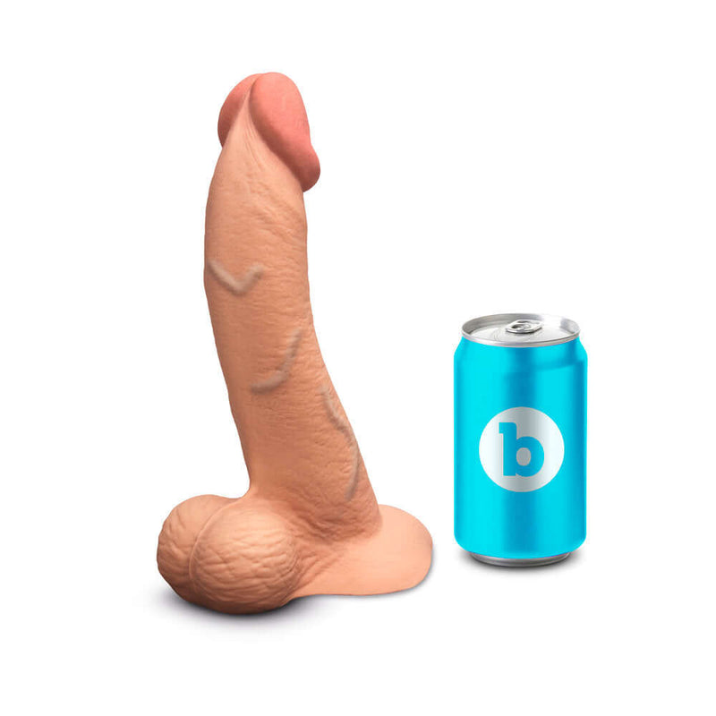 b-Vibe Slipskin Realistic Silicone Dildo 9 inch Curved Mocha next to a soda can for size comparison.