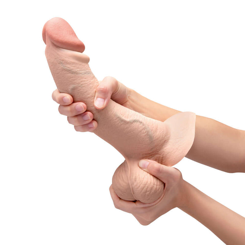 b-Vibe Slipskin Realistic Silicone Dildo 10 inch Curved Cream held in hands for realistic sensual experience