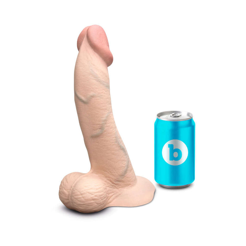 b-Vibe Slipskin Realistic Silicone Dildo 10 inch Curved Cream next to a soft drink can for size comparison.