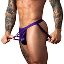 Male Power Eggplant Crossover Jock Plum S/M showcased on a muscular model, featuring a contoured pouch and crossover straps.