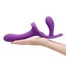 Together Lock-In Dual-Ended Vibrating Strap-on & Harness Set held in hand, showcasing its design and vibrant color.