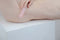 Using the Chakrubs Heart Curve Rose Quartz Wand for self-love and emotional harmony on a soothing surface.