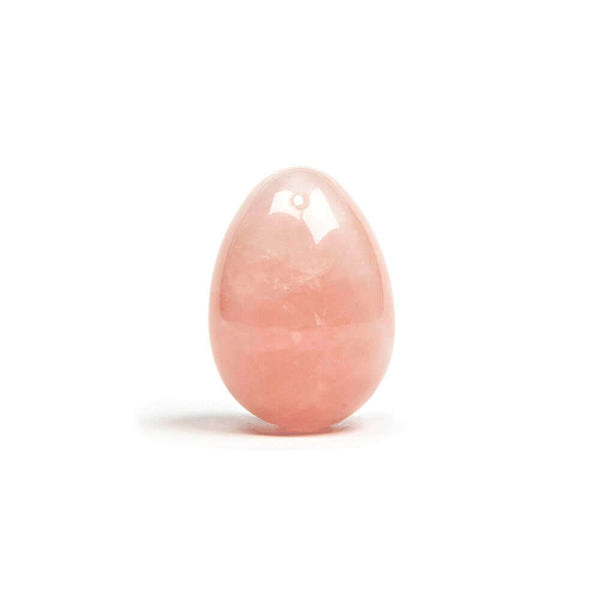 Chakrubs Heart Yoni Egg Rose Quartz drilled in a polished light pink design, ideal for pelvic floor strengthening and emotional healing.