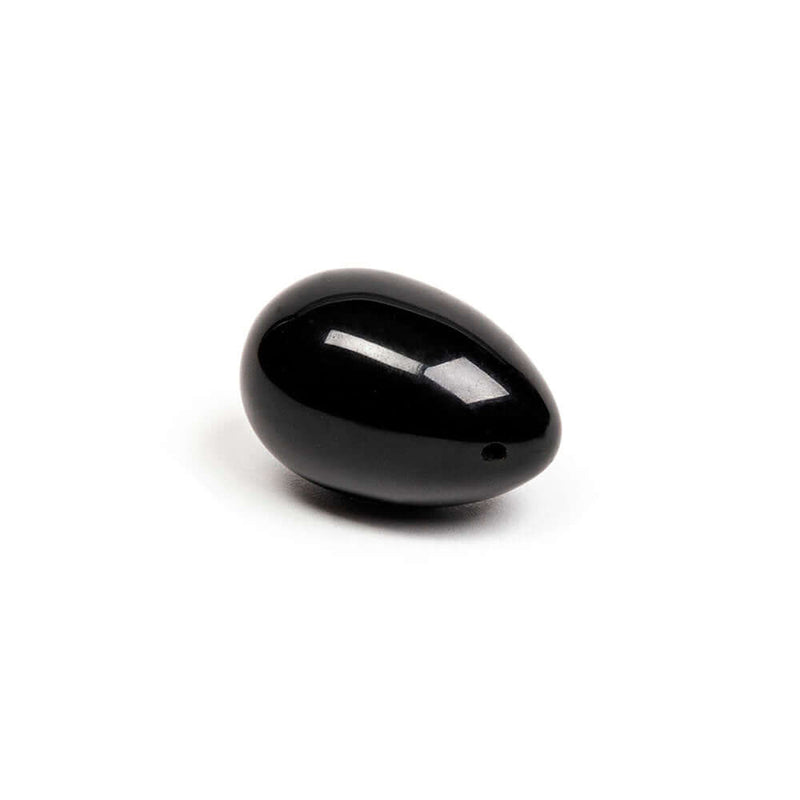 Chakrubs Xaga Yoni Egg Obsidian drilled, a polished black obsidian egg for pelvic floor strengthening and emotional grounding.