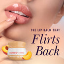 Sweetums Flavored Lip Balm Honey in a stylish jar with smooth, glossy lips in the background.