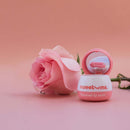 Sweetums Flavored Lip Balm Sweet Rose with a pink rose backdrop for a romantic lip care routine.