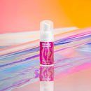 Love To Love Super Smooth Lubricant Foam 3.3 Oz in a vibrant setting, showcasing its unique foam texture.