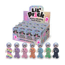 Lil Pricks Mystery Box 12 Piece Keychain Display features colorful plush vibrating penis keychains in a retail display.
