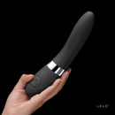 LELO Elise 2 Dual Powered Massager Black held in hand against a dark background.