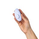 Dame Lay Panty Vibrator With Remote Control held in hand, showcasing its ergonomic design for discreet pleasure.