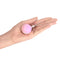 Intimina LASELLE Small 28 g Weighted Kegel Exerciser held in a hand for pelvic floor strength training.