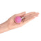 Intimina LASELLE Medium 38 g Weighted Kegel Exerciser held in hand for pelvic floor training.