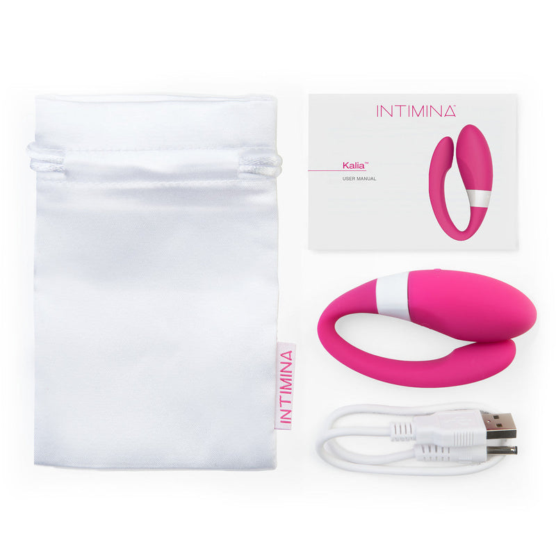 Intimina KALIA Couples Massager in pink with user manual and charging cable, designed for intimate pleasure.